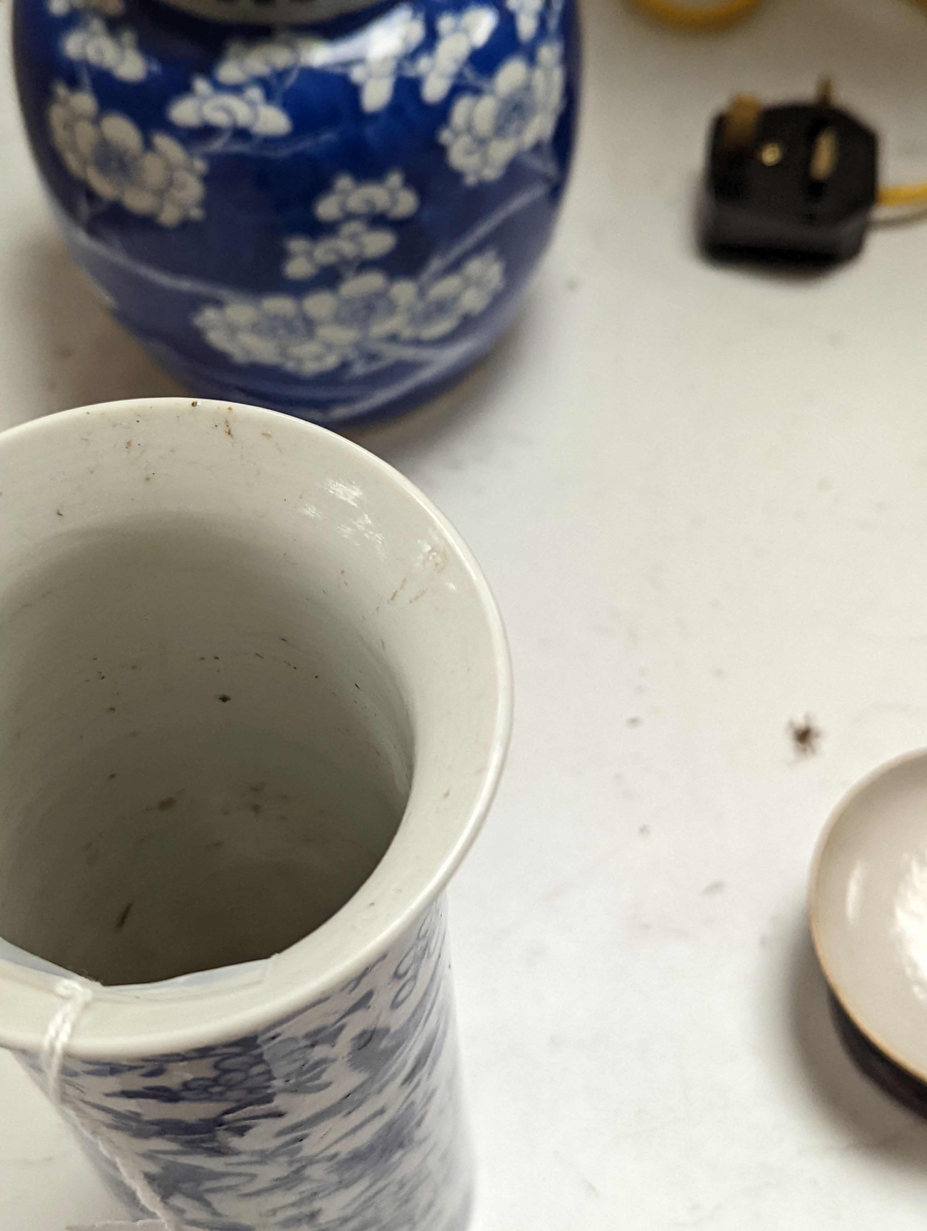 A Chinese famille rose ginger jar, a 19th century Chinese blue and white porcelain jar and cover, a blue and white cylinder vase, a small Chinese dish and orange glass vase (5)